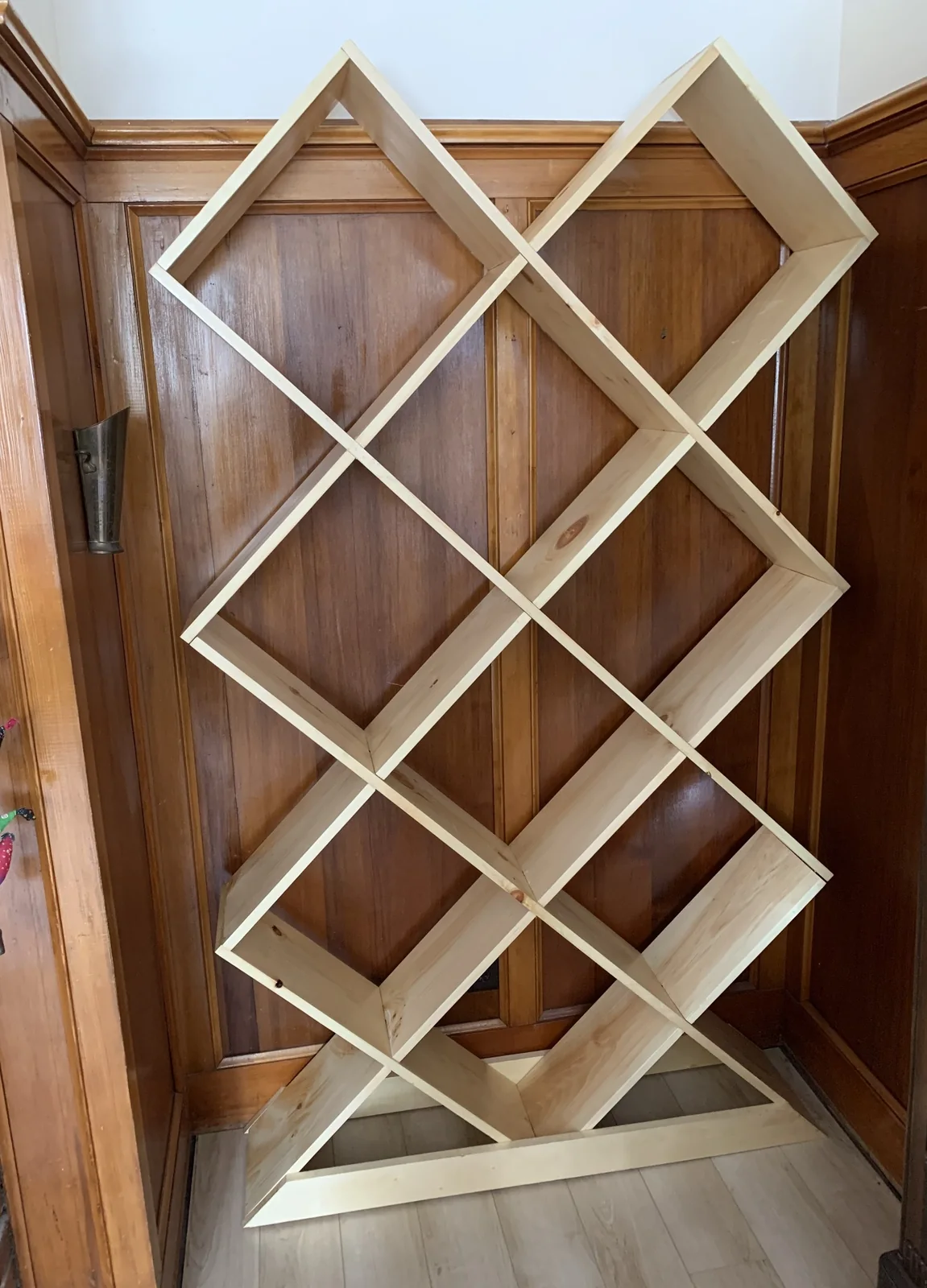 Diamond-shaped custom bookshelf built by Johnston Reno